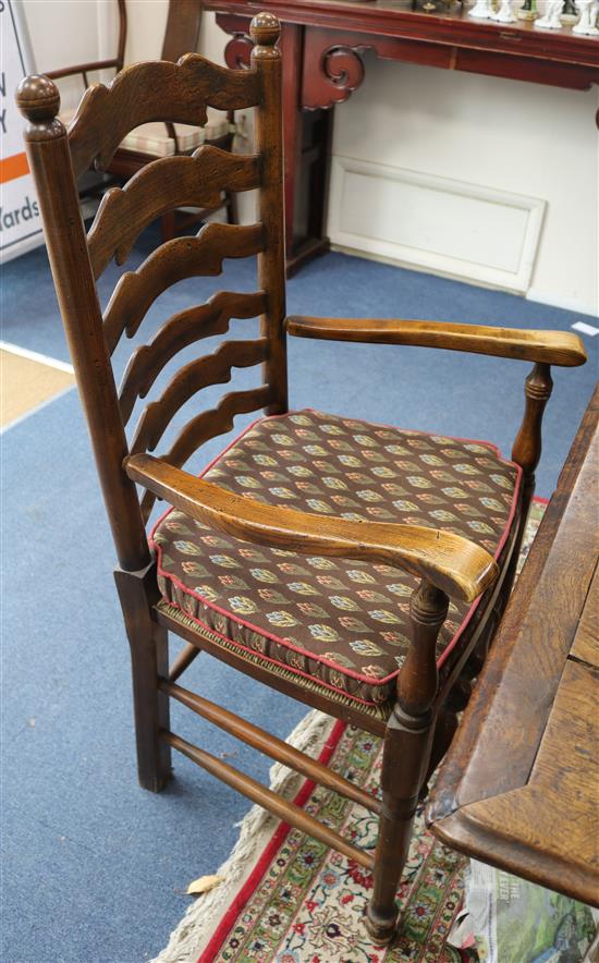 A set of six reproduction ash and elm rush seated ladderback chairs